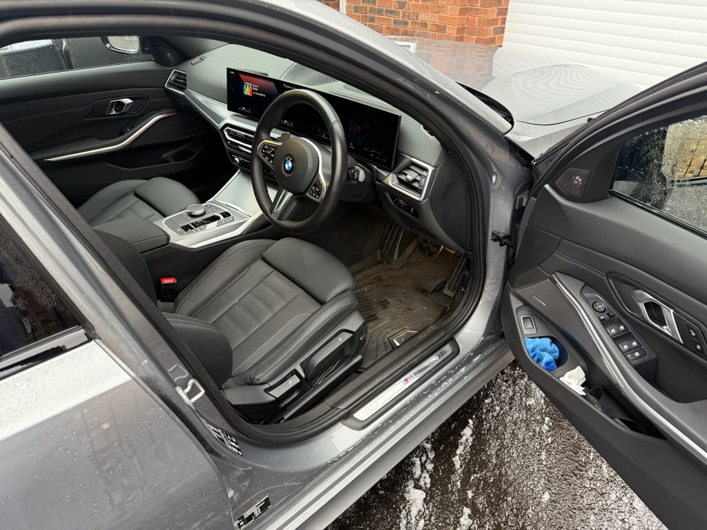 BMW 3 Series before — dirty floor mats, soiled and cluttered interior cabin