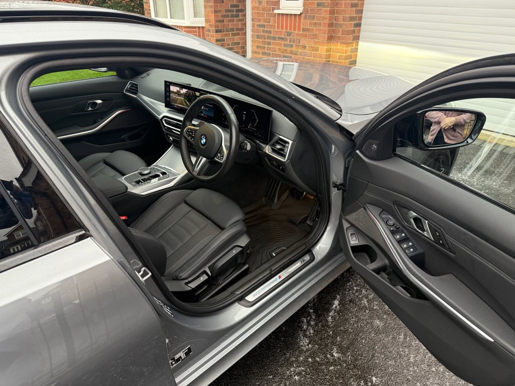 BMW 3 Series after — spotless cabin with clean leather seats and fresh floor mats