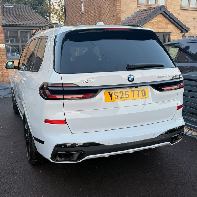 BMW X7 after — bright white finish fully restored with gleaming clean panels