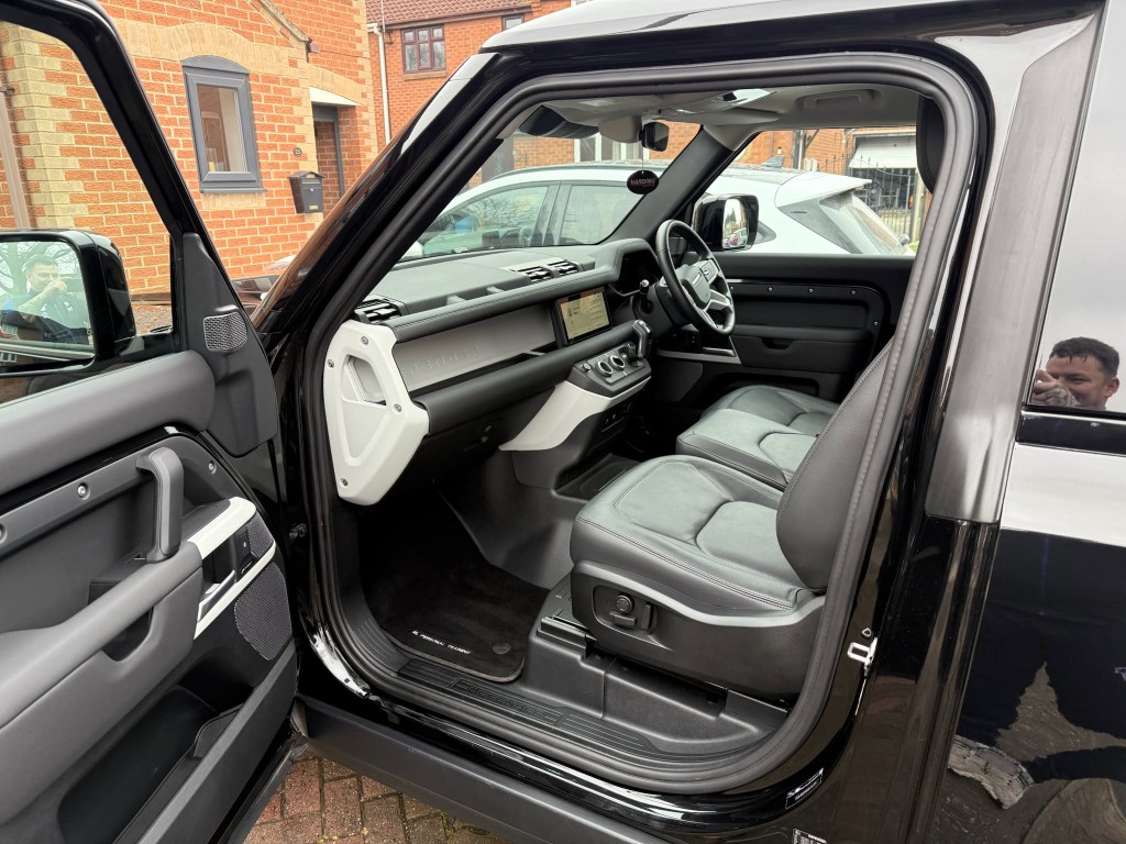 Land Rover Defender interior after — grey leather cleaned, door panel and sills spotless
