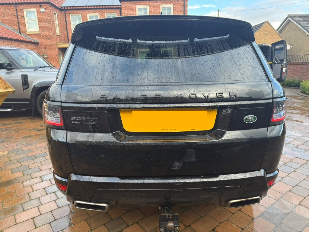 Range Rover Sport after — deep gloss black finish, clean badges, exhausts and bodywork