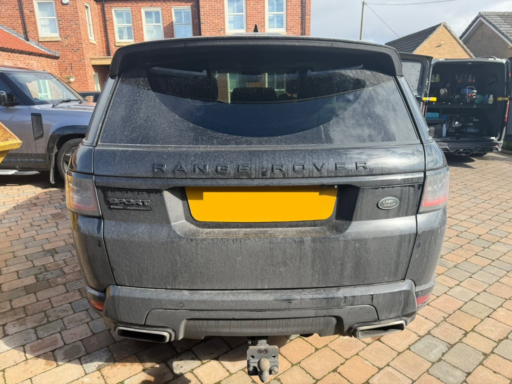 Range Rover Sport before — heavily soiled exterior, thick dust and grime across all panels