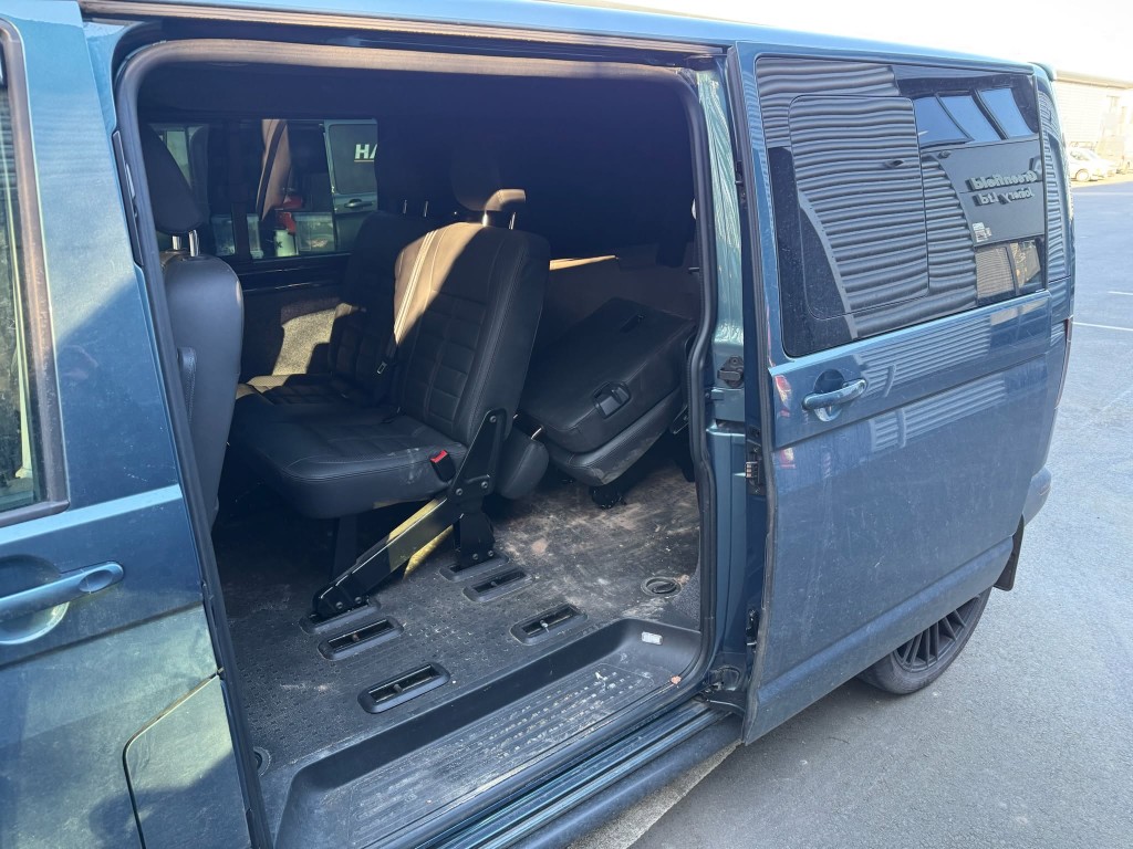 VW Transporter interior before — heavily soiled floor, grime and dust throughout