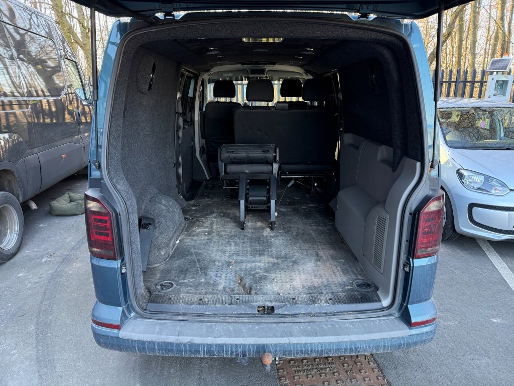 VW Transporter before — heavily soiled cargo area with dirt and grime on floor